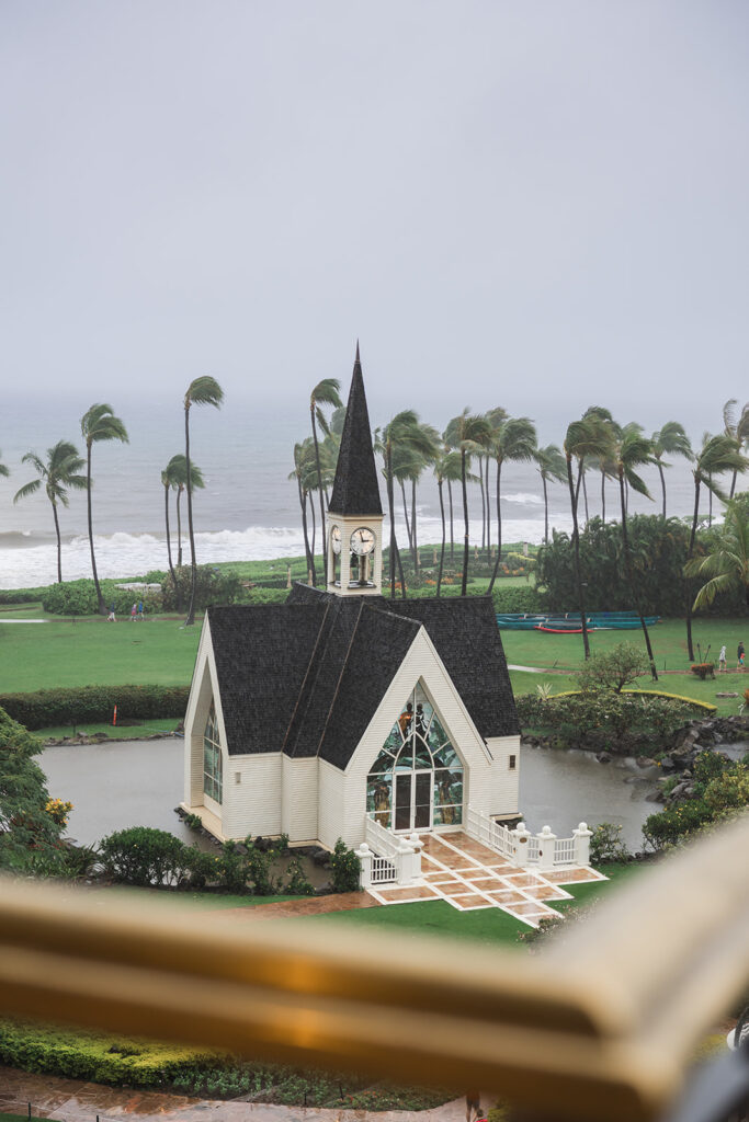 Matias Ezcurra Photography, Grand Wailea Maui wedding chapel on a small island, surrounded by water and palm trees, on a cloudy day.
