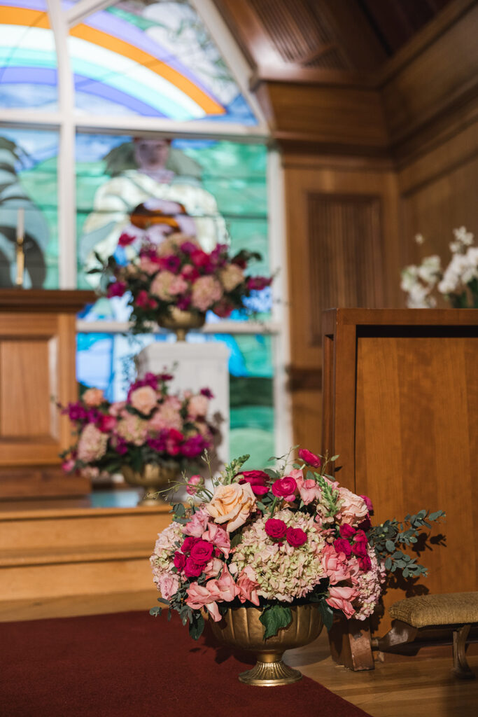Matias Ezcurra Photography, Church wedding floral arrangements with pink roses and hydrangeas.