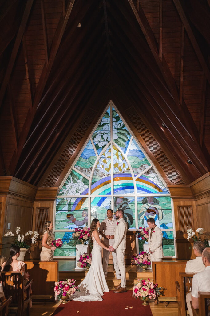 Matias Ezcurra Photography, Grand Wailea Maui wedding ceremony with bride and groom holding hands.