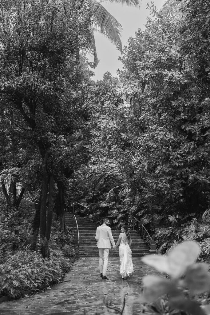 Matias Ezcurra Photography, Couple walking up stairs at their Grand Wailea Maui wedding.