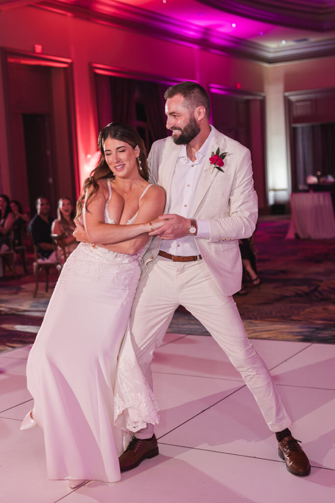 Matias Ezcurra Photography, Bride and groom joyfully dancing at their Grand Wailea Maui wedding reception.