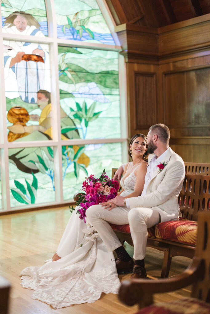 Matias Ezcurra Photography, Grand Wailea Maui wedding: Bride and groom sitting in chapel.