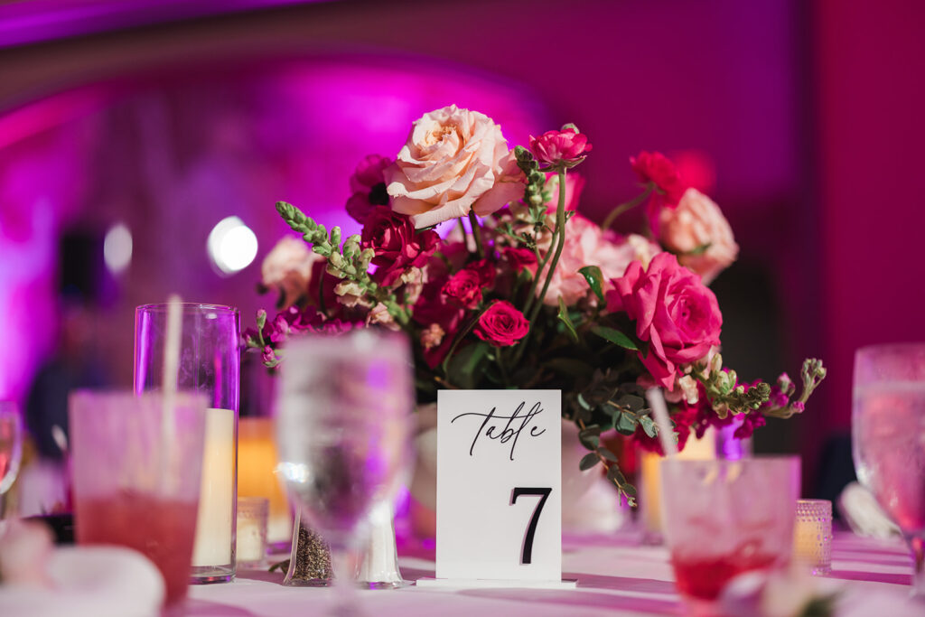Matias Ezcurra Photography, Table 7 at a Grand Wailea Maui wedding reception with pink floral centerpiece.