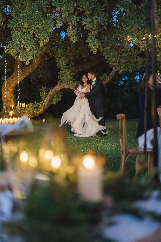 Matias Ezcurra Photography, Couple dancing at a luxury Maui wedding venue under fairy lights.