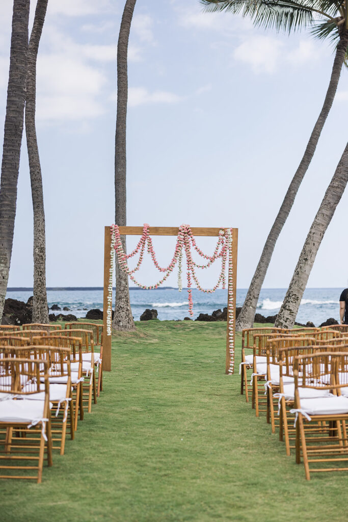 Matias Ezcurra Photography, Outdoor wedding ceremony setup at a luxury Maui venue with floral arch and chairs