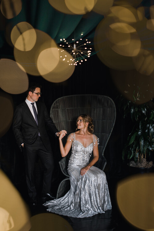 Matias Ezcurra Photography, Bride and groom holding hands, elegant wedding attire.