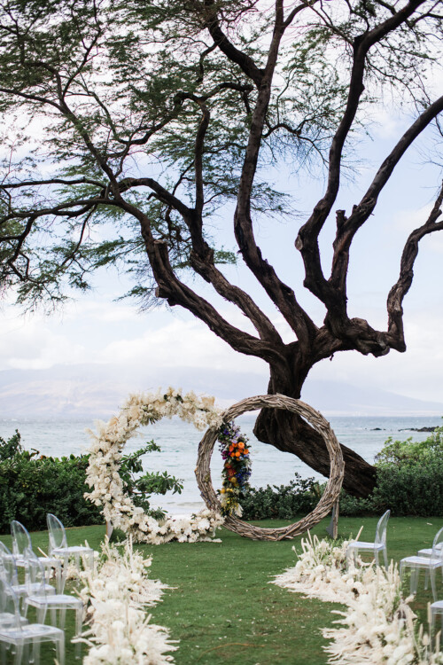 Matias Ezcurra Photography, Beach wedding ceremony setup with floral hoops and aisle decor.