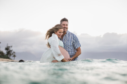 Matias Ezcurra Photography, Pregnant Lauren Luyendyk and Arie Luyendyk Jr. embrace in the ocean on Maui.