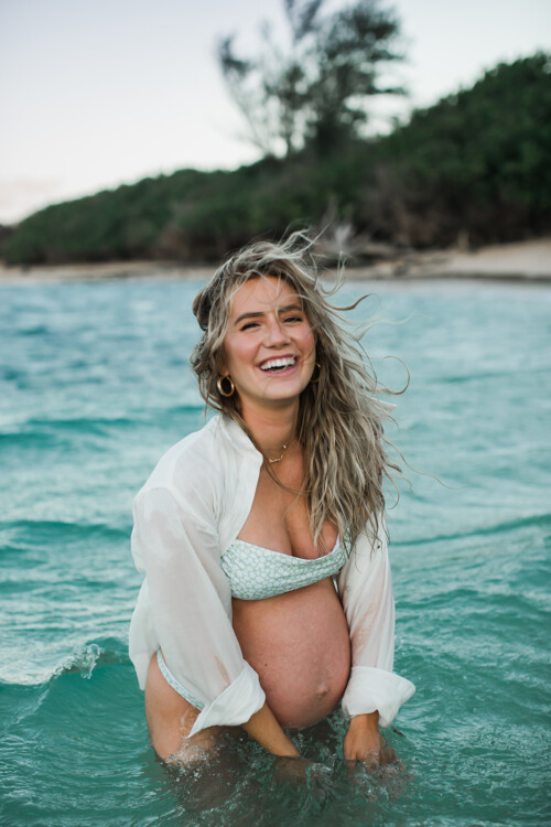 Matias Ezcurra Photography, Pregnant Lauren in Maui, laughing in the ocean