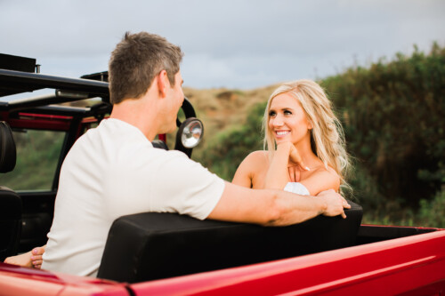 Matias Ezcurra Photography, Arie and Lauren share a romantic moment in a red Jeep on Maui.