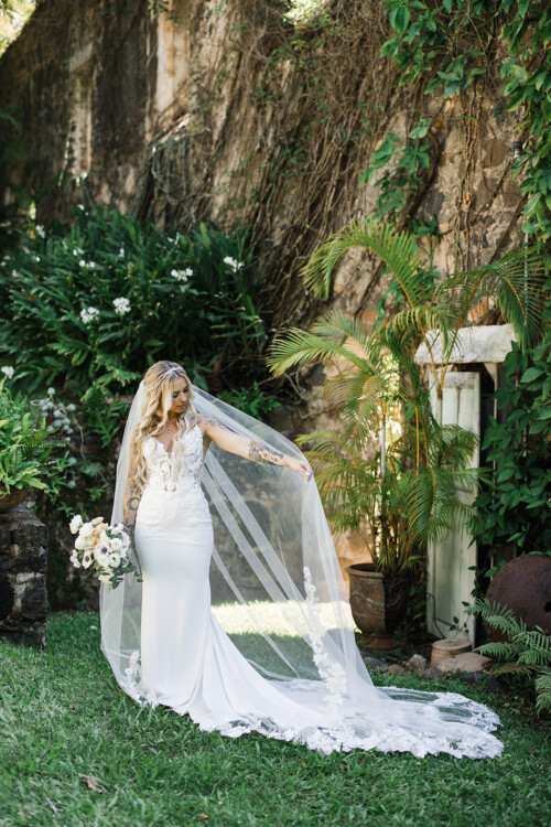 Matias Ezcurra Photography, Bride in lace wedding dress and long veil at Haiku Mill