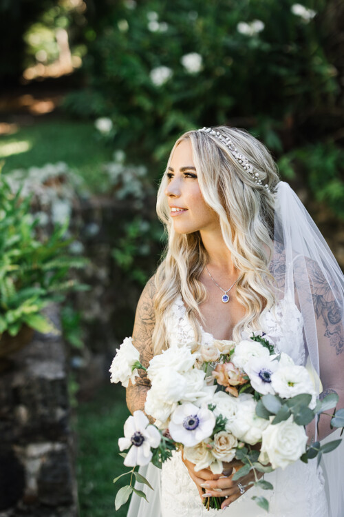 Matias Ezcurra Photography, Bride in lace wedding dress with floral bouquet at Haiku Mill wedding.
