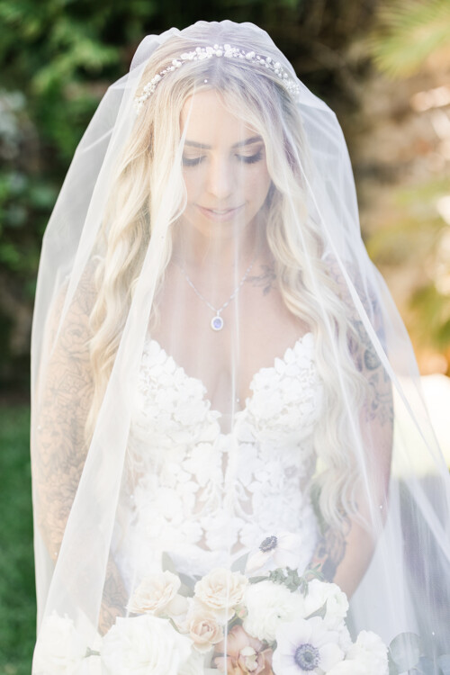 Matias Ezcurra Photography, Bride at Haiku Mill wedding, veiled and holding bouquet.