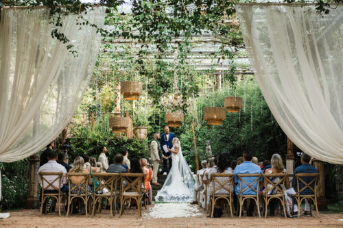 Matias Ezcurra Photography, Bride and groom exchanging vows at their outdoor Haiku Mill wedding ceremony.
