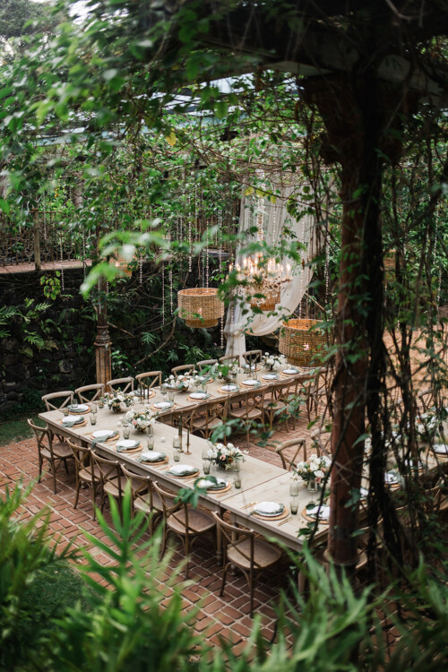 Matias Ezcurra Photography, Romantic outdoor wedding reception at Haiku Mill, featuring long tables, lush greenery, and elegant lighting.
