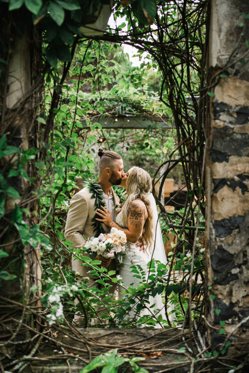 Matias Ezcurra Photography, Bride and groom kissing at Haiku Mill wedding, Maui.