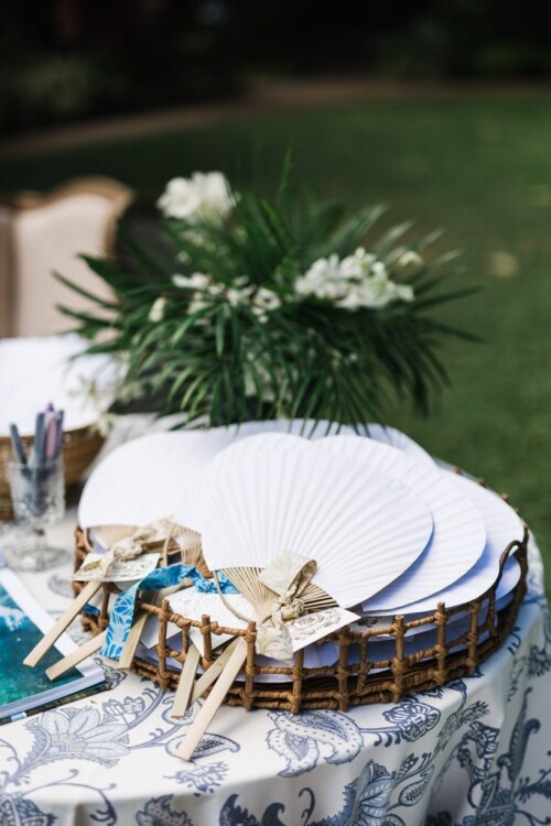 Matias Ezcurra Photography, White paper fans with blue ribbon details, wedding favors at an Olowalu Plantation wedding.