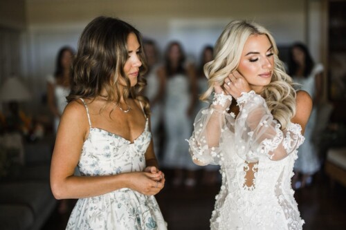 Matias Ezcurra Photography, Bride getting ready for her Olowalu Plantation wedding, assisted by a bridesmaid.