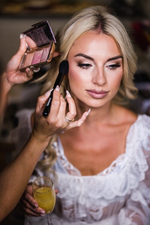 Matias Ezcurra Photography, Bride getting makeup applied before her Olowalu Plantation wedding.