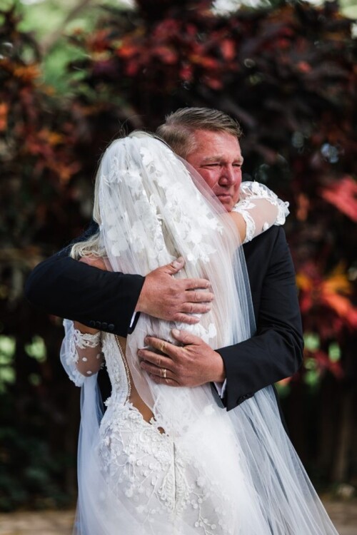 Matias Ezcurra Photography, Father of the bride hugs his daughter at her Olowalu Plantation wedding.