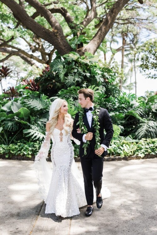 Matias Ezcurra Photography, Bride and groom stroll hand-in-hand at their Olowalu Plantation wedding.