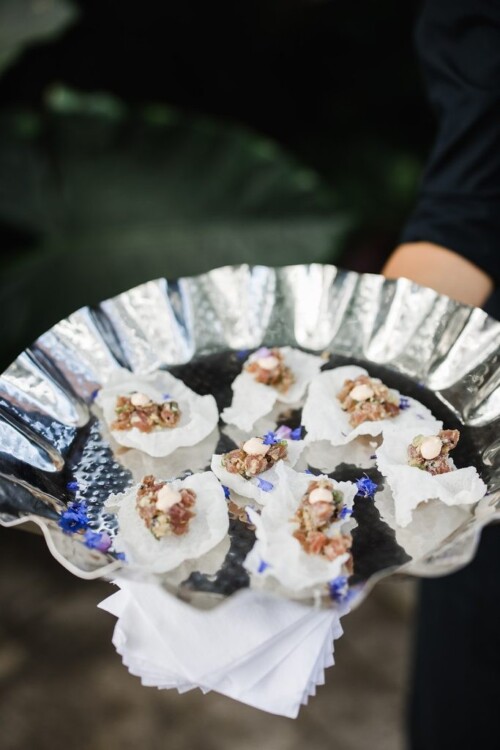 Matias Ezcurra Photography, Appetizers on a silver platter at a wedding reception.