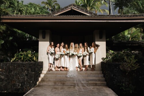 Matias Ezcurra Photography, Bride and bridesmaids in cream silk dresses pose on steps, holding bouquets.