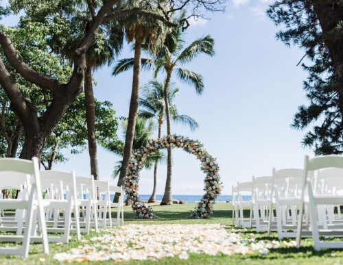 Matias Ezcurra Photography, Circular floral wedding arch with white chairs and petal aisle