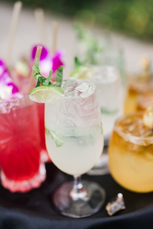 Matias Ezcurra Photography, Refreshing summer cocktails: mojito, margarita, and whiskey sour garnished with lime and mint.