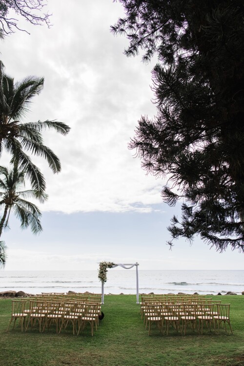 Matias Ezcurra Photography, Beach wedding ceremony setup at Olowalu Plantation House with chairs facing ocean view.