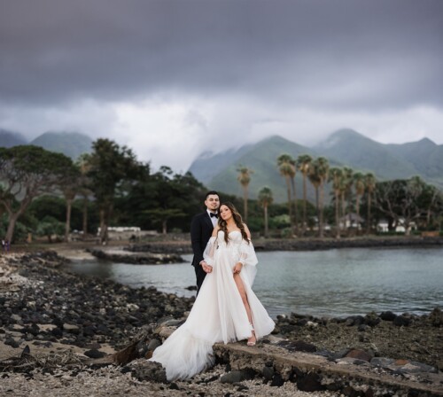 Matias Ezcurra Photography, Bride and groom holding hands at Olowalu Plantation House, Maui. Romantic beach wedding photo.