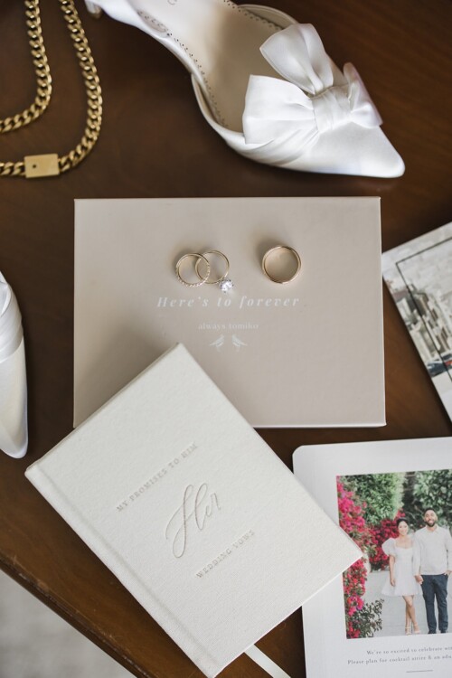 Matias Ezcurra Photography, Wedding details: rings, vows book, shoes, and invitation. Klaire & Alex's Kualoa Ranch wedding.