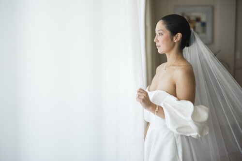 Matias Ezcurra Photography, Bride in elegant off-the-shoulder gown at Kualoa Ranch wedding