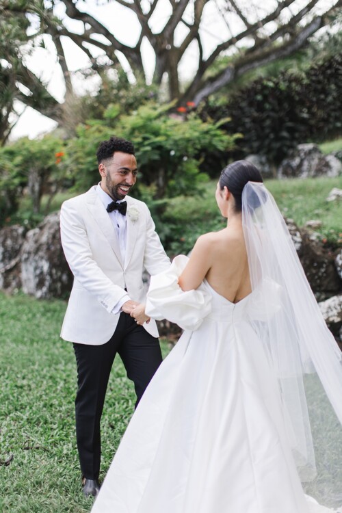 Matias Ezcurra Photography, Bride and groom share a first look at their Kualoa Ranch wedding.