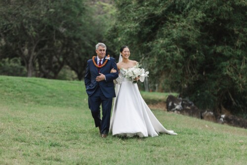 Matias Ezcurra Photography, Bride and father walking down aisle at Kualoa Ranch wedding.
