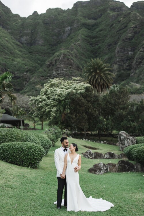 Matias Ezcurra Photography, Bride and groom embrace at their Kualoa Ranch wedding. Luxury wedding in Hawaii.