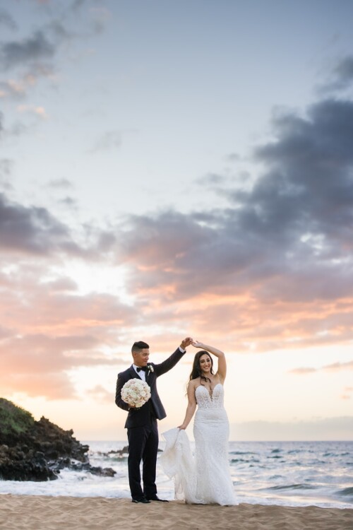 Matias Ezcurra Photography, Bride and groom dancing on beach at sunset.