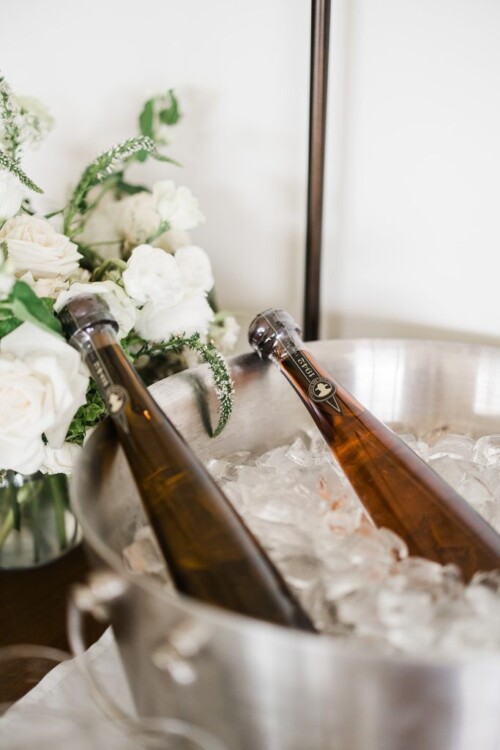 Matias Ezcurra Photography, Two bottles of tequila chilled in an ice bucket at an Andaz Maui wedding.
