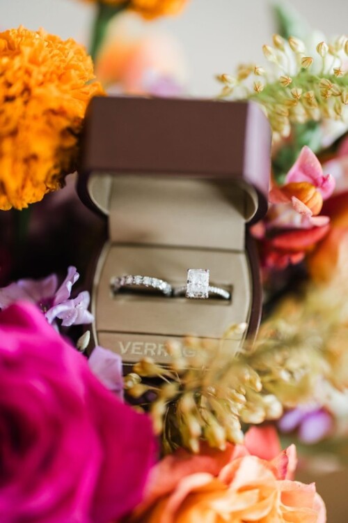 Matias Ezcurra Photography, Wedding rings in a box nestled in colorful flowers. Andaz Maui wedding.