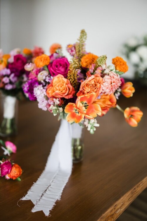 Matias Ezcurra Photography, Vibrant orange and pink wedding bouquet with white ribbon, Andaz Maui wedding.