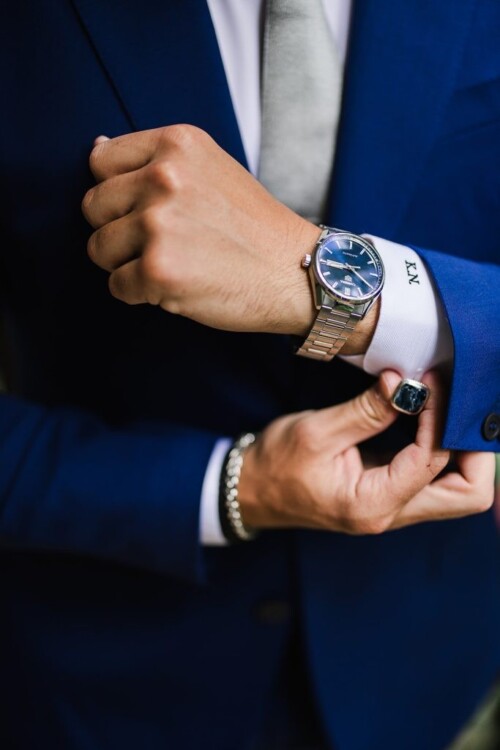 Matias Ezcurra Photography, Groom adjusts cufflinks, showing watch and monogrammed shirt; Andaz Maui wedding detail.