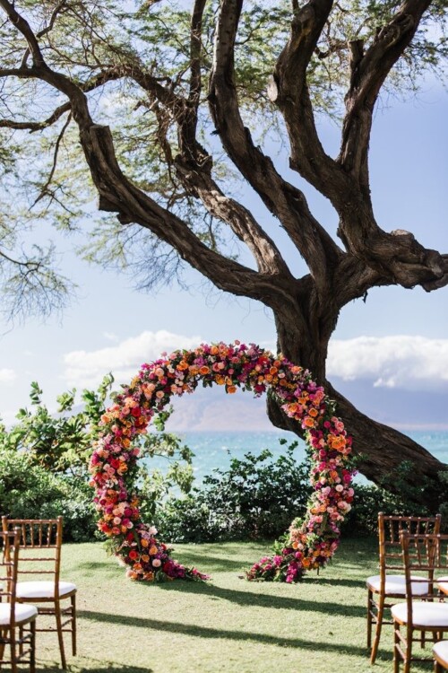 Matias Ezcurra Photography, Floral wedding arch at Andaz Maui ceremony overlooking ocean.