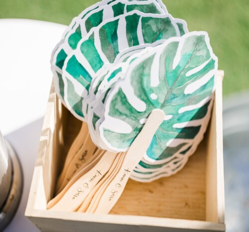Matias Ezcurra Photography, Wooden box of personalized hand fans with watercolor monstera leaves; Serra & Kevin wedding favor.
