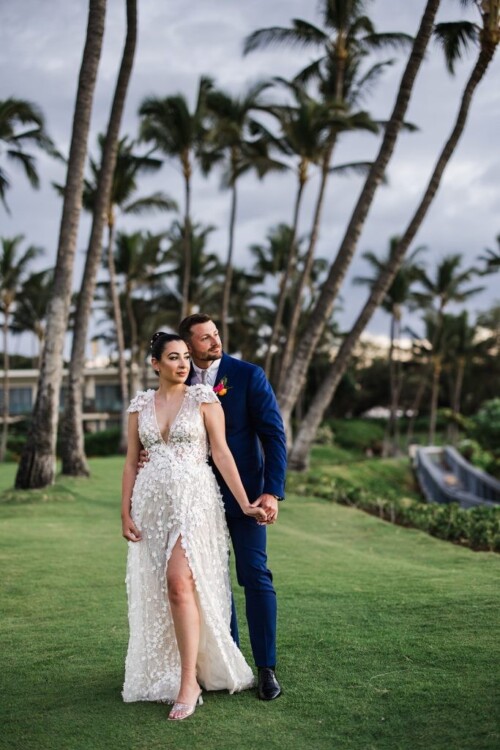 Matias Ezcurra Photography, Happy couple, Serra & Kevin, holding hands at their Andaz Maui wedding. Bride in a stunning gown.