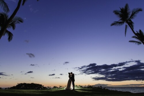 Matias Ezcurra Photography, Silhouette of bride and groom embracing at sunset, Andaz Maui wedding.